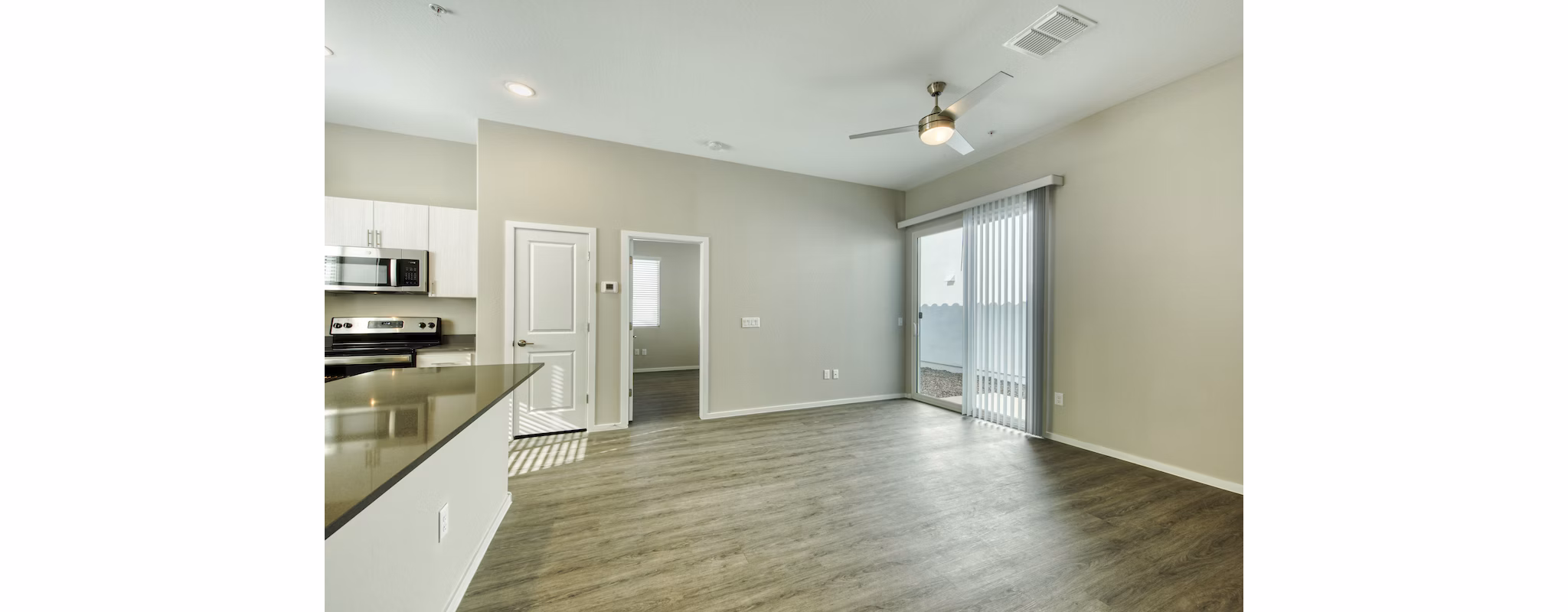 Modern living room with elegant furnishings at Abode at Litchfield Park Apartments, featuring sleek design and cozy ambiance