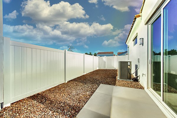 Abode at Litchfield Park Apartments: Stylish patio with modern seating and greenery for luxury outdoor living