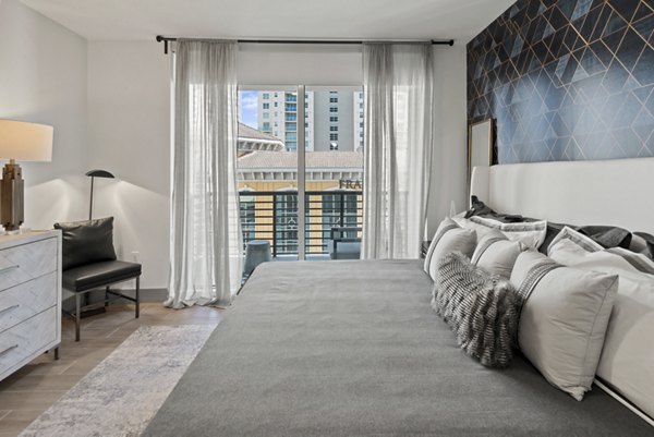 Chic bedroom with modern decor at NOVO Las Olas Apartments, offering luxury living in the heart of downtown Fort Lauderdale