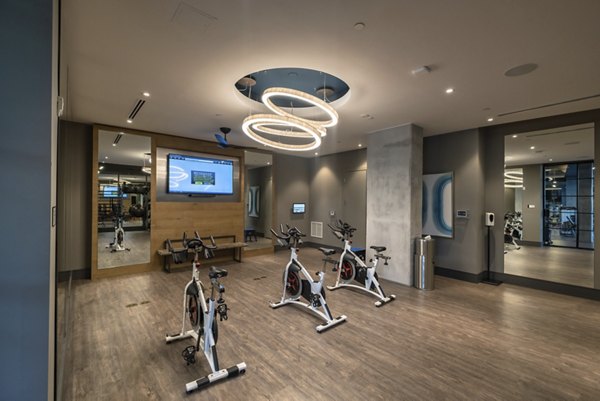 Modern fitness center in NOVO Las Olas Apartments featuring state-of-the-art equipment and spacious workout areas