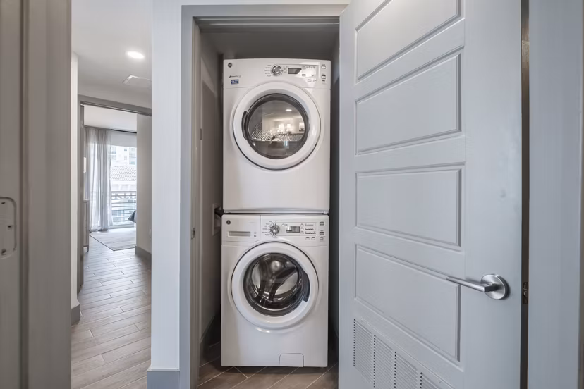 Laundry room with modern appliances at NOVO Las Olas Apartments