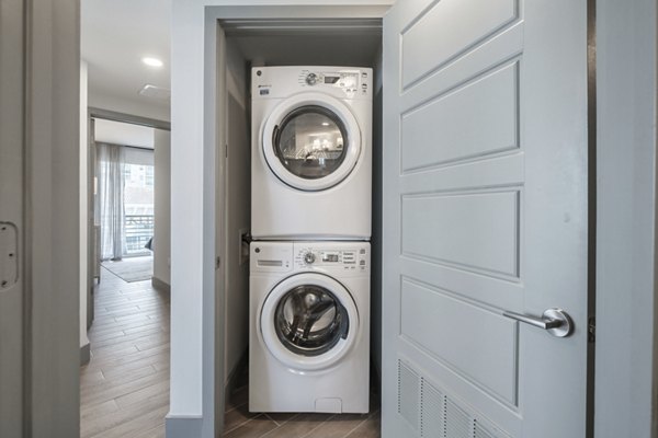 Laundry room with modern appliances at NOVO Las Olas Apartments