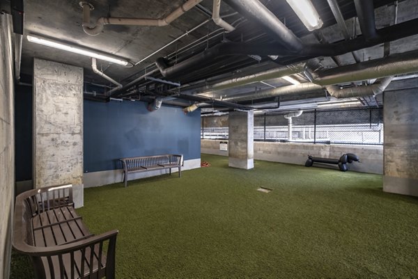 Dog park with agility obstacles at NOVO Las Olas Apartments, a pet-friendly Greystar community in Fort Lauderdale
