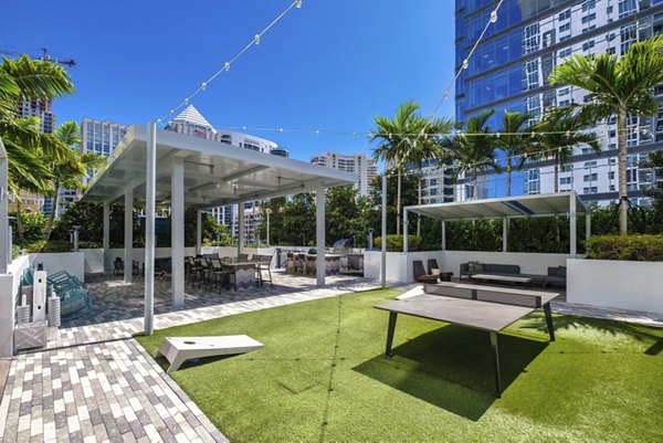Inviting courtyard with lush greenery at NOVO Las Olas Apartments