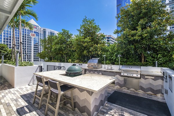 Modern outdoor patio with stylish seating at NOVO Las Olas Apartments, perfect for relaxation and social gatherings in a luxury setting