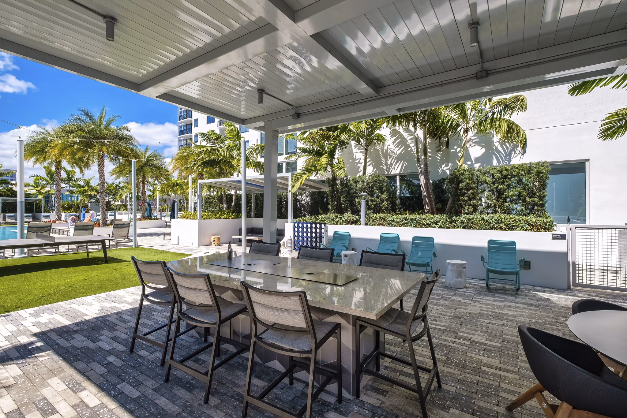 Spacious patio with stylish seating at NOVO Las Olas Apartments, ideal for outdoor relaxation in luxury urban living