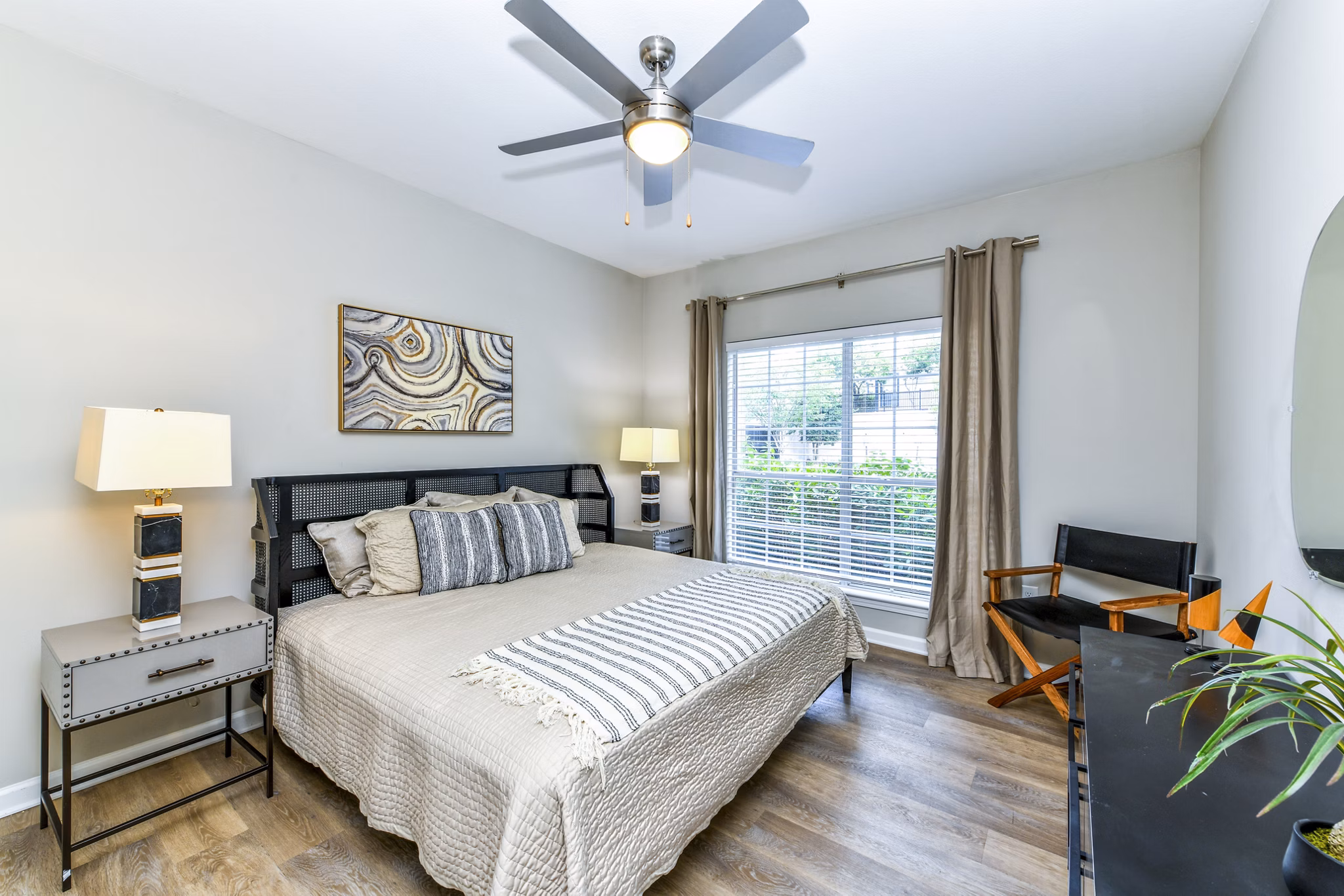 Cozy bedroom with elegant decor at Avana Cheshire Bridge Apartments in Atlanta