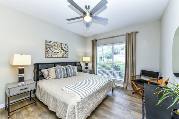 Cozy bedroom with elegant decor at Avana Cheshire Bridge Apartments in Atlanta