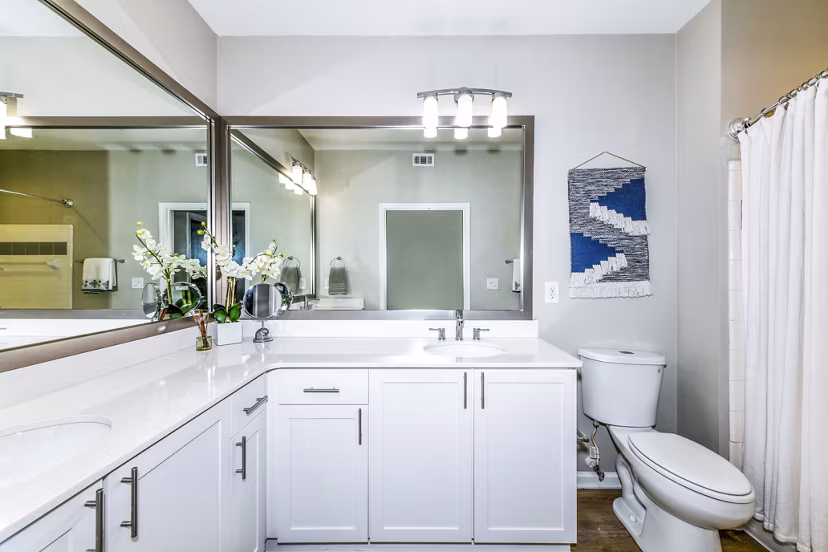 Bathroom with sleek fixtures and marble countertops at Avana Cheshire Bridge Apartments