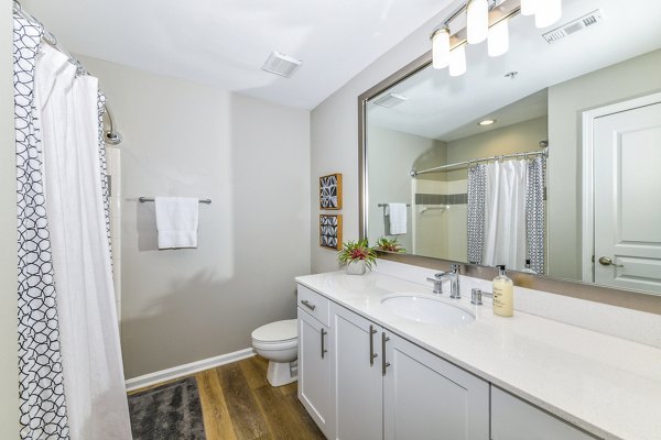 Modern bathroom with sleek fixtures and ample storage at Avana Cheshire Bridge Apartments, offering luxurious living in Atlanta