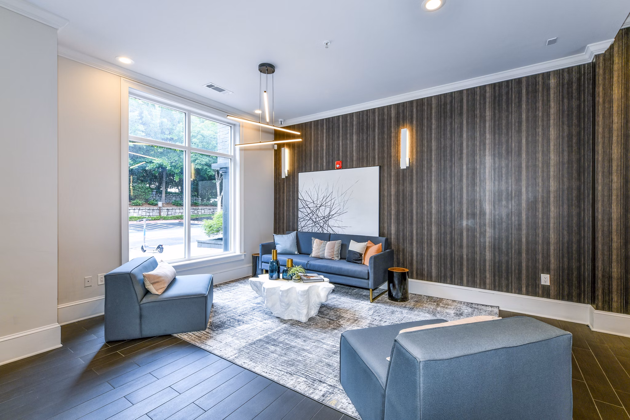 Modern clubhouse featuring elegant lobby area at Avana Cheshire Bridge Apartments, offering luxurious amenities and stylish design
