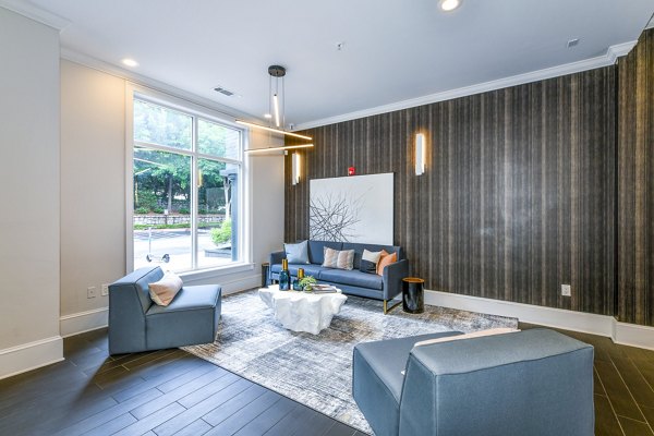 Modern clubhouse featuring elegant lobby area at Avana Cheshire Bridge Apartments, offering luxurious amenities and stylish design
