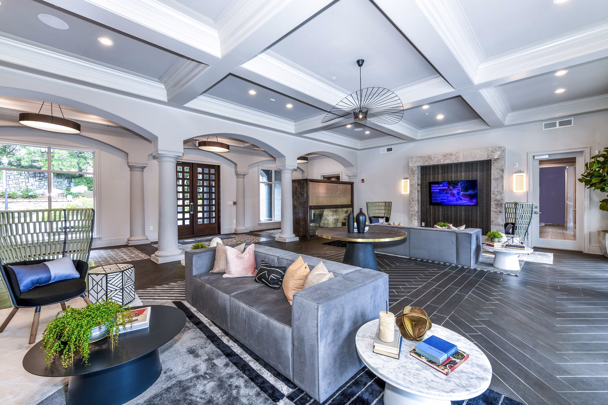 Inviting clubhouse lobby with cozy seating at Avana Cheshire Bridge Apartments
