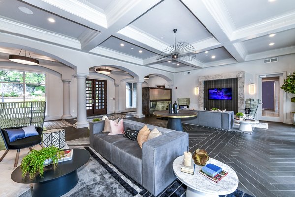 Inviting clubhouse lobby with cozy seating at Avana Cheshire Bridge Apartments