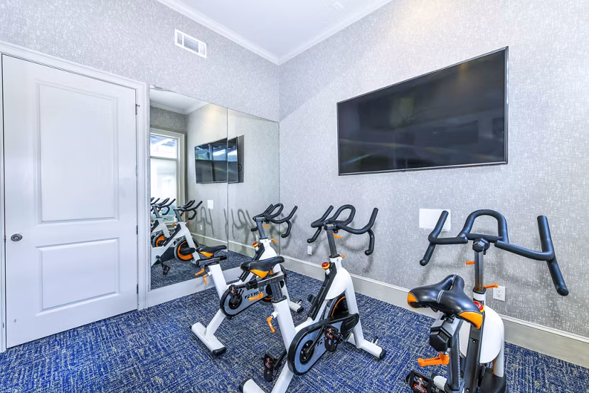 Modern spin studio with state-of-the-art equipment at Avana Cheshire Bridge Apartments, ideal for fitness enthusiasts seeking luxury living amenities