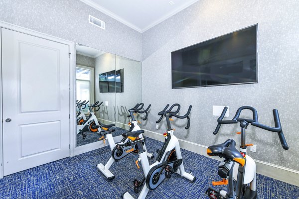 Modern spin studio with state-of-the-art equipment at Avana Cheshire Bridge Apartments, ideal for fitness enthusiasts seeking luxury living amenities