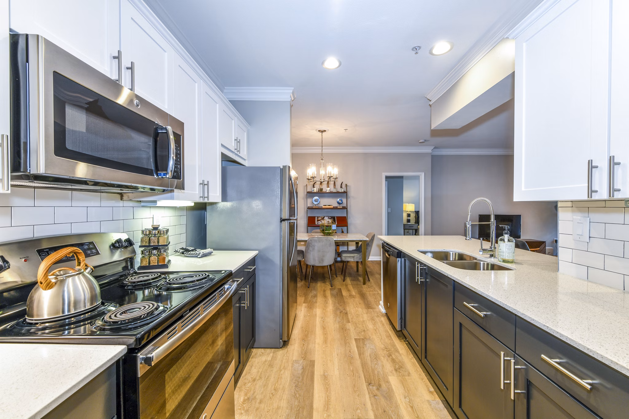 Modern kitchen with sleek countertops and stainless steel appliances at Avana Cheshire Bridge Apartments
