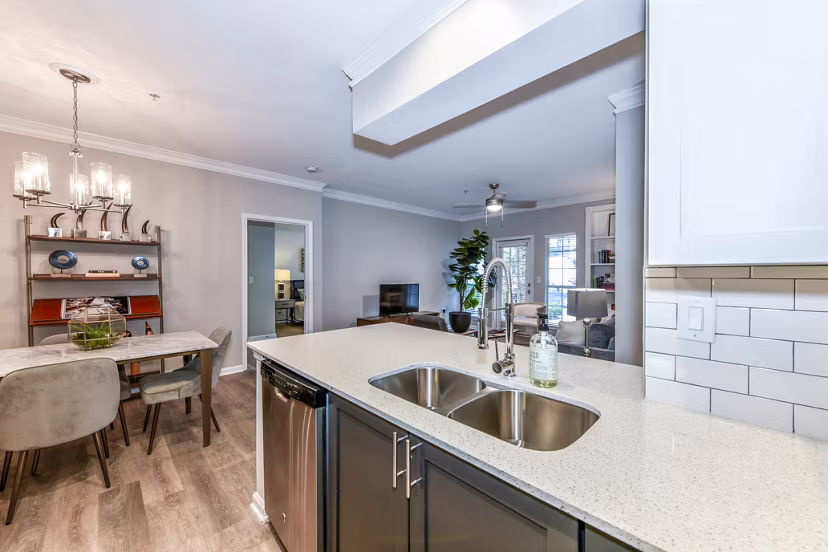 Kitchens with modern appliances and sleek countertops at Avana Cheshire Bridge Apartments