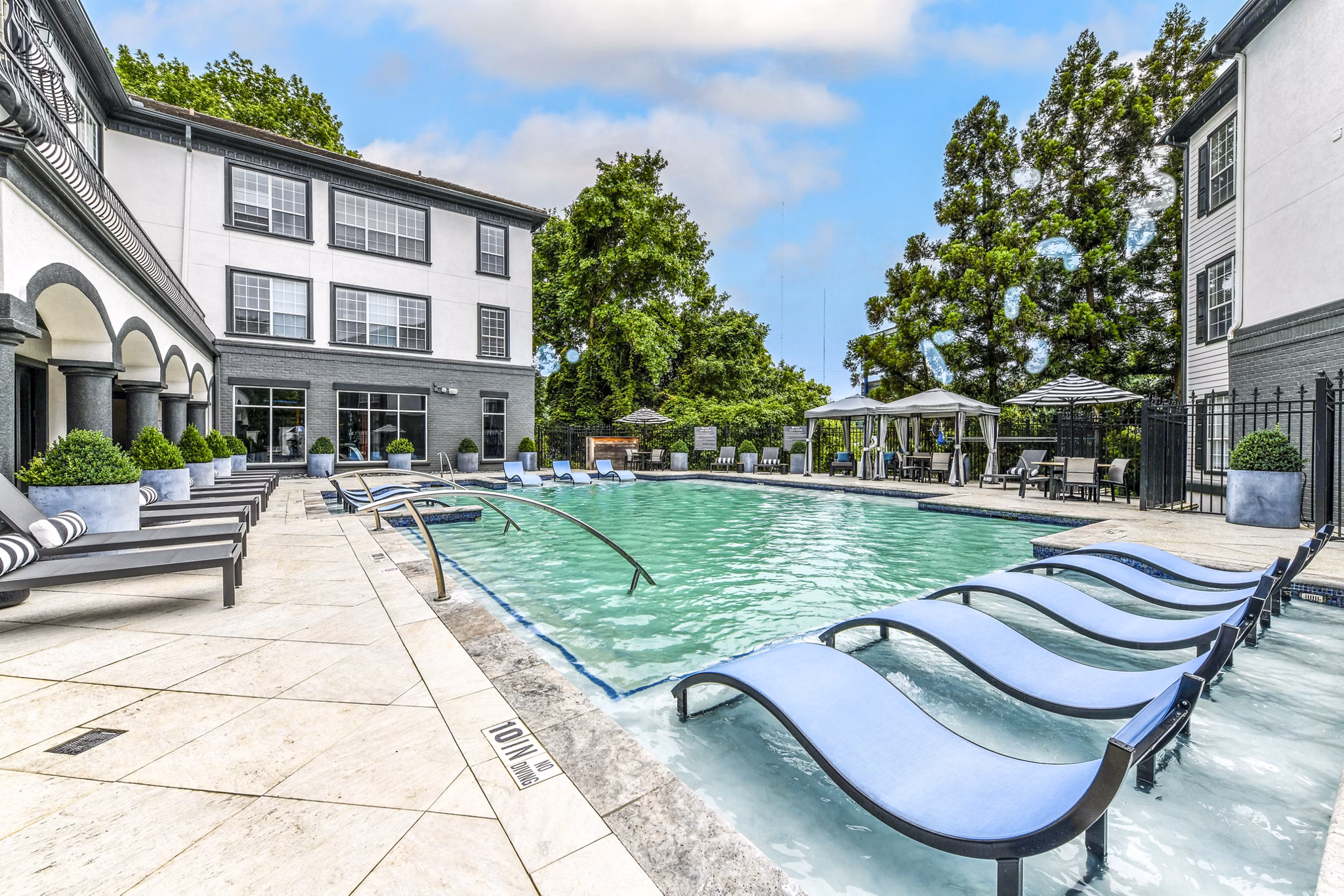Resort-style swimming pool at Avana Cheshire Bridge Apartments in Atlanta offering luxury leisure and relaxation