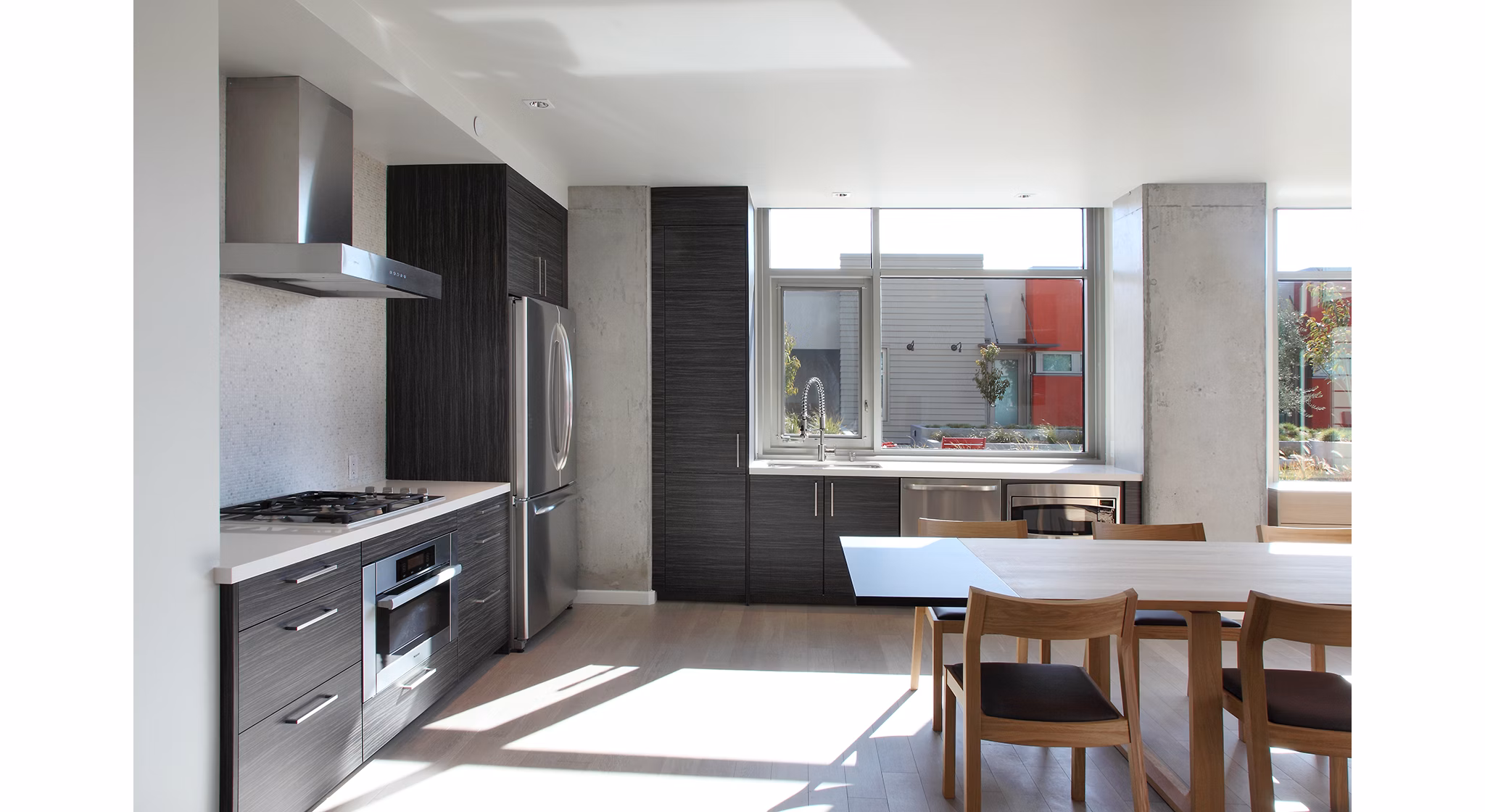 Community Room kitchen featuring modern appliances and island seating at Greystar's 17837CLB2 luxury apartments