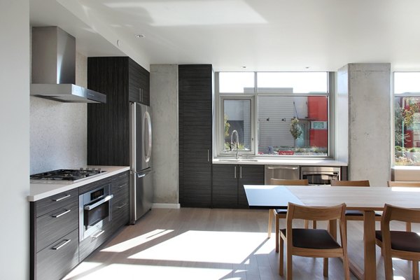 Community Room kitchen featuring modern appliances and island seating at Greystar's 17837CLB2 luxury apartments