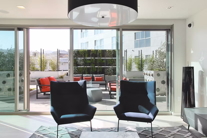 Community room with terrace lounge access at  luxury apartments