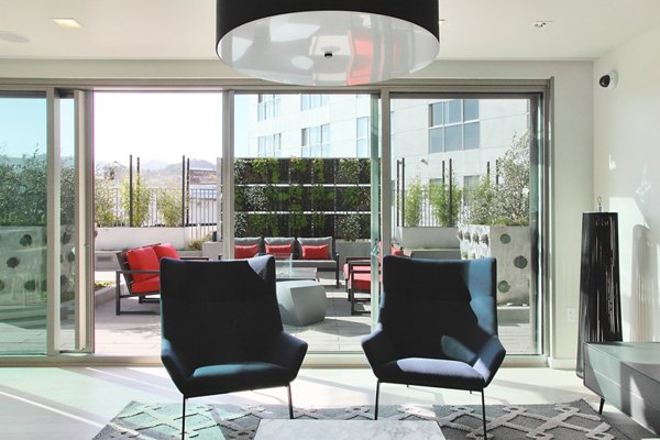 Community room with terrace lounge access at  luxury apartments