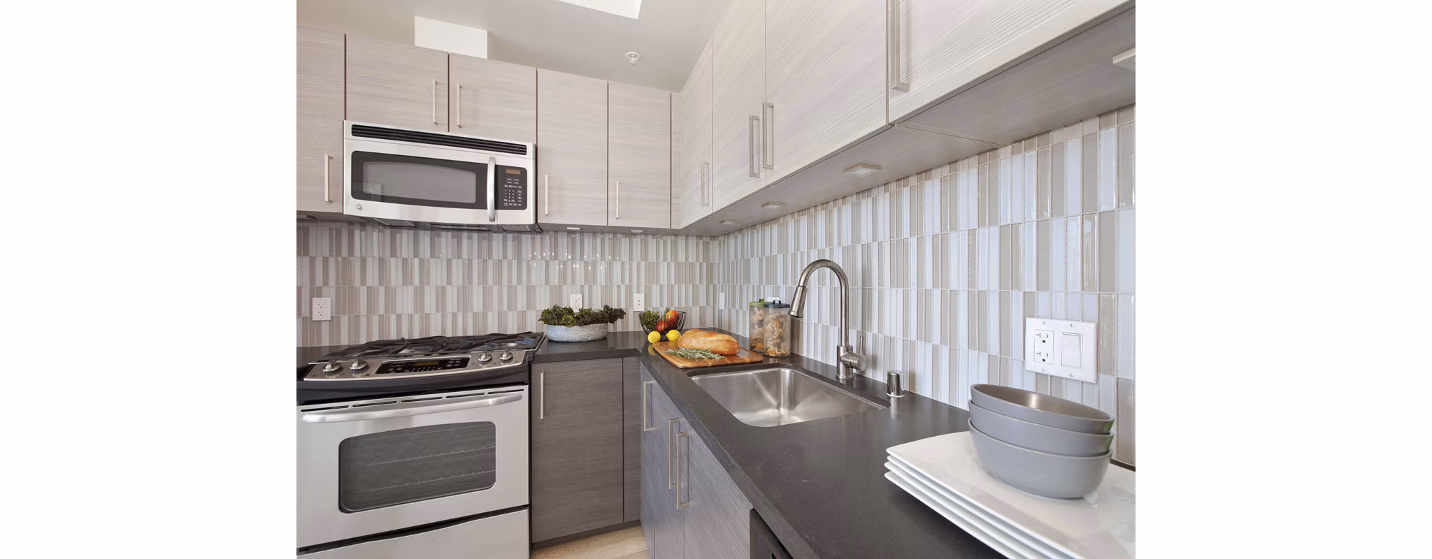Modern kitchen with stainless steel appliances at 38 Dolores Apartments, a luxury property in a prime San Francisco location