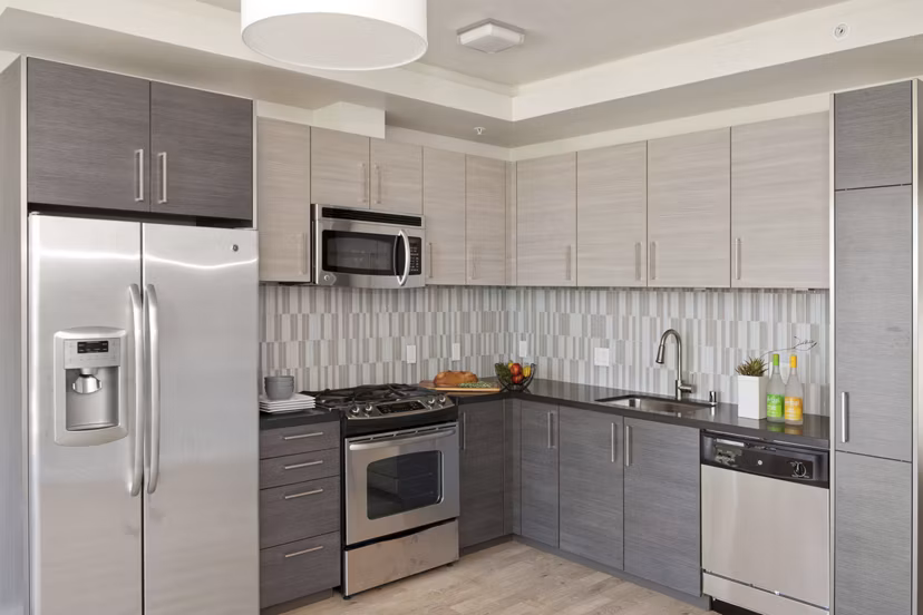 Kitchen with modern appliances and sleek design at 38 Dolores Apartments