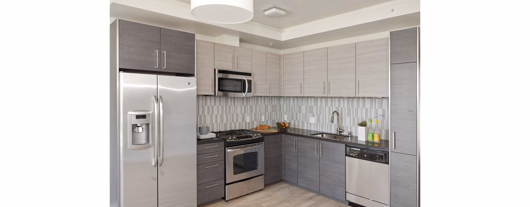 Kitchen with modern appliances and sleek design at 38 Dolores Apartments