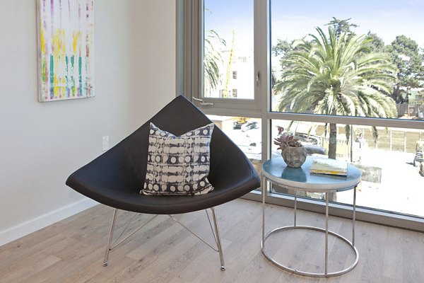 Modern living room with stylish furniture and natural lighting at 38 Dolores Apartments, featuring luxurious Greystar design elements