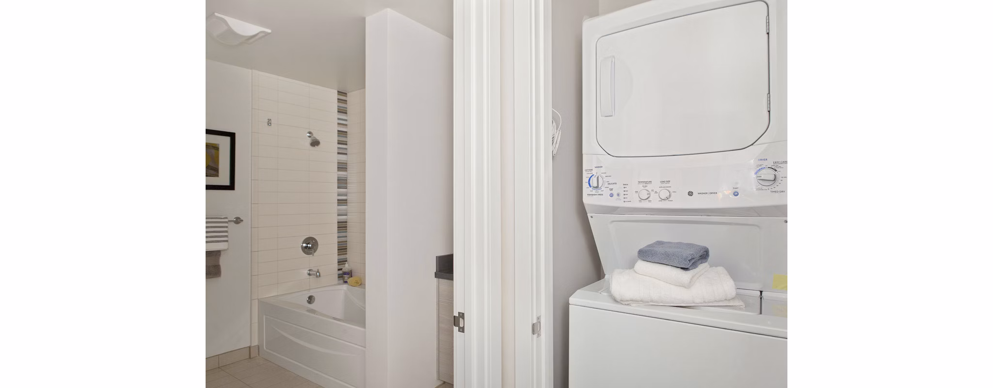 Laundry room with modern washers and dryers at 38 Dolores Apartments