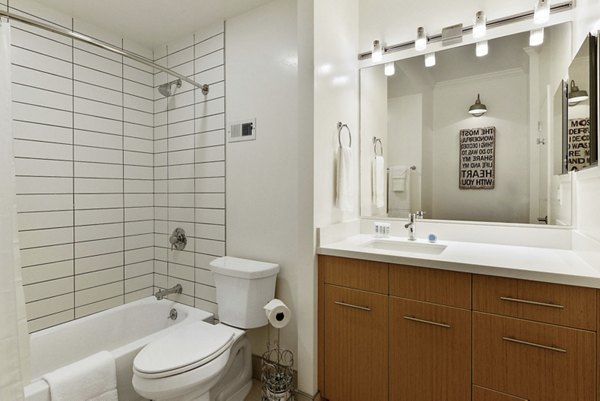 Elegant bathroom with marble countertops and modern fixtures in Nob Hill Tower Apartments