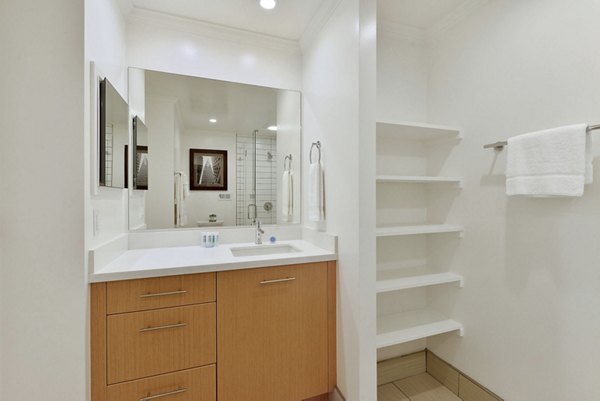 Elegant bathroom with marble countertops at Nob Hill Tower Apartments, luxury residence in prime city location
