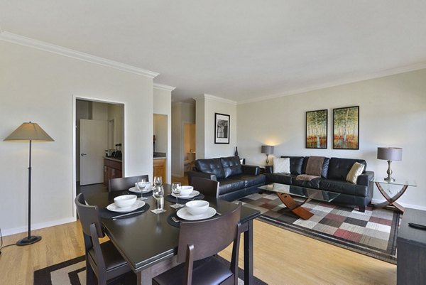 Elegant dining area with modern furnishings at Nob Hill Tower Apartments, featuring a luxurious setting perfect for entertaining