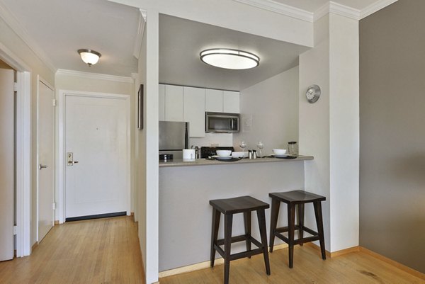 Modern kitchen with stainless steel appliances in Nob Hill Tower Apartments