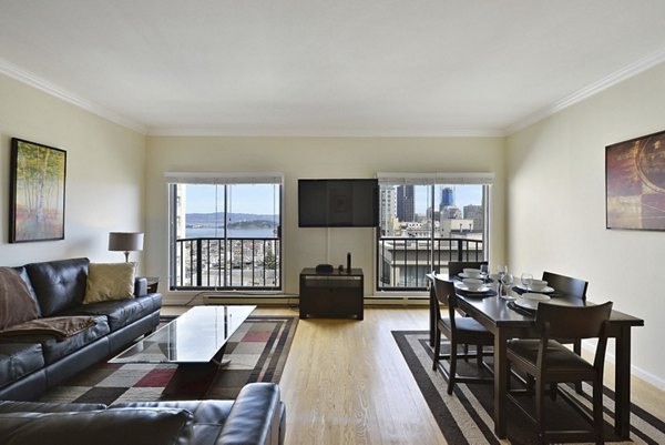 Spacious living room with modern furnishings at Nob Hill Tower Apartments in San Francisco, offering luxury living with stunning city views