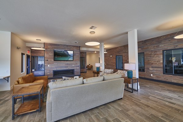 Clubhouse with modern design and lounging area at Alpine Vista Apartments