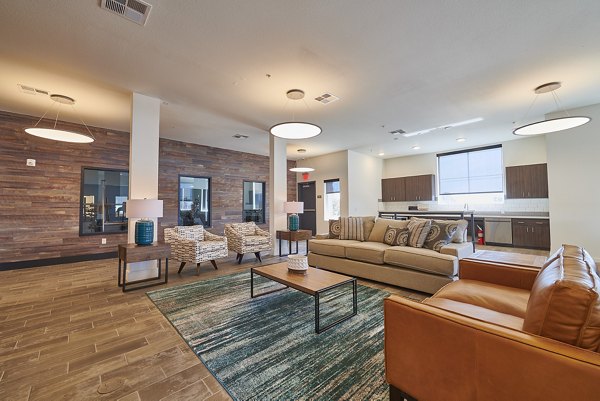 Clubhouse with modern furnishings at Alpine Vista Apartments, offering luxury amenities and social spaces for residents