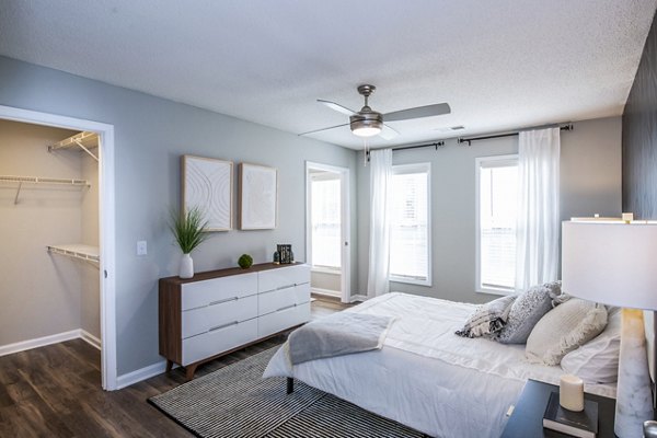 Cozy bedroom with neutral decor at Avana Avebury Apartments
