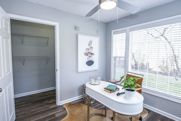 Modern home office with ergonomic chair and large desk in Avana Avebury Apartments