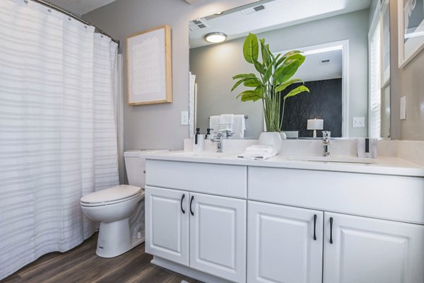 Modern bathroom featuring sleek fixtures and ample countertop space in Avana Avebury Apartments