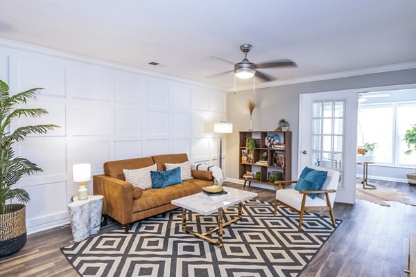 Spacious living room with contemporary furnishings in Avana Avebury Apartments
