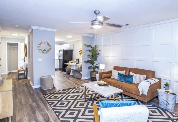 Spacious living room with modern decor at Avana Avebury Apartments