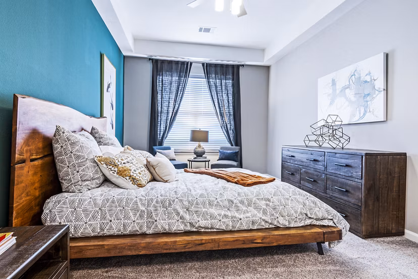 Cozy bedroom with elegant decor at The Landing at Tiffany Springs Apartments