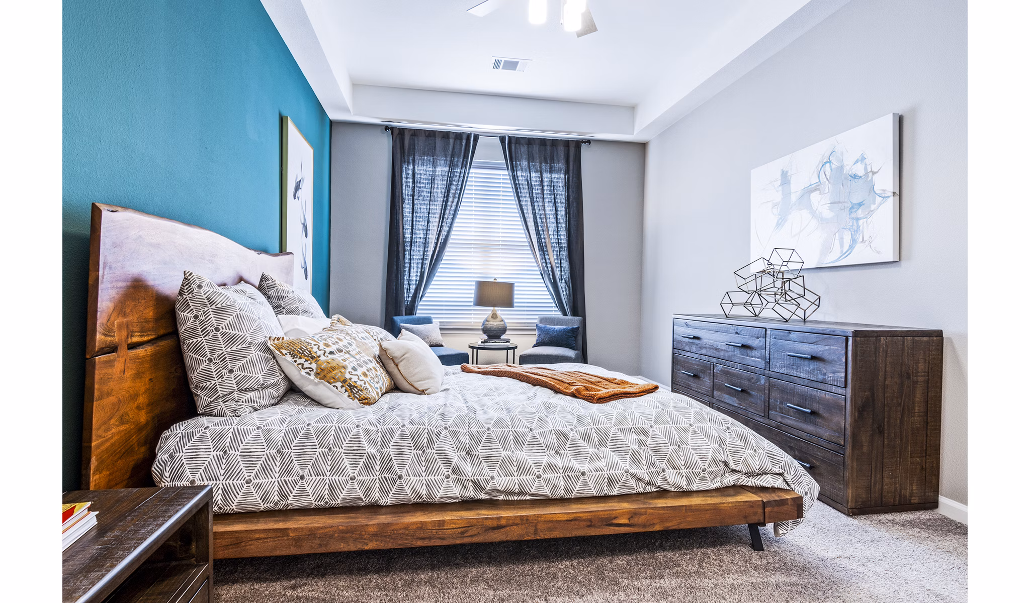 Cozy bedroom with elegant decor at The Landing at Tiffany Springs Apartments