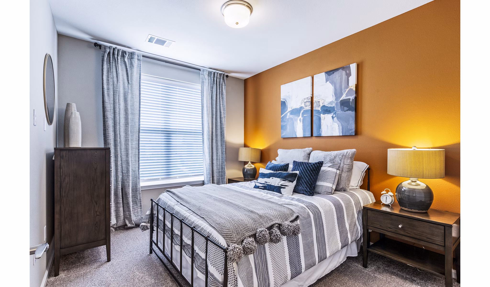 Elegant bedroom with modern furnishings at The Landing at Tiffany Springs Apartments