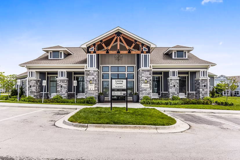 Clubhouse lobby with modern dÃ©cor and cozy seating at The Landing at Tiffany Springs Apartments