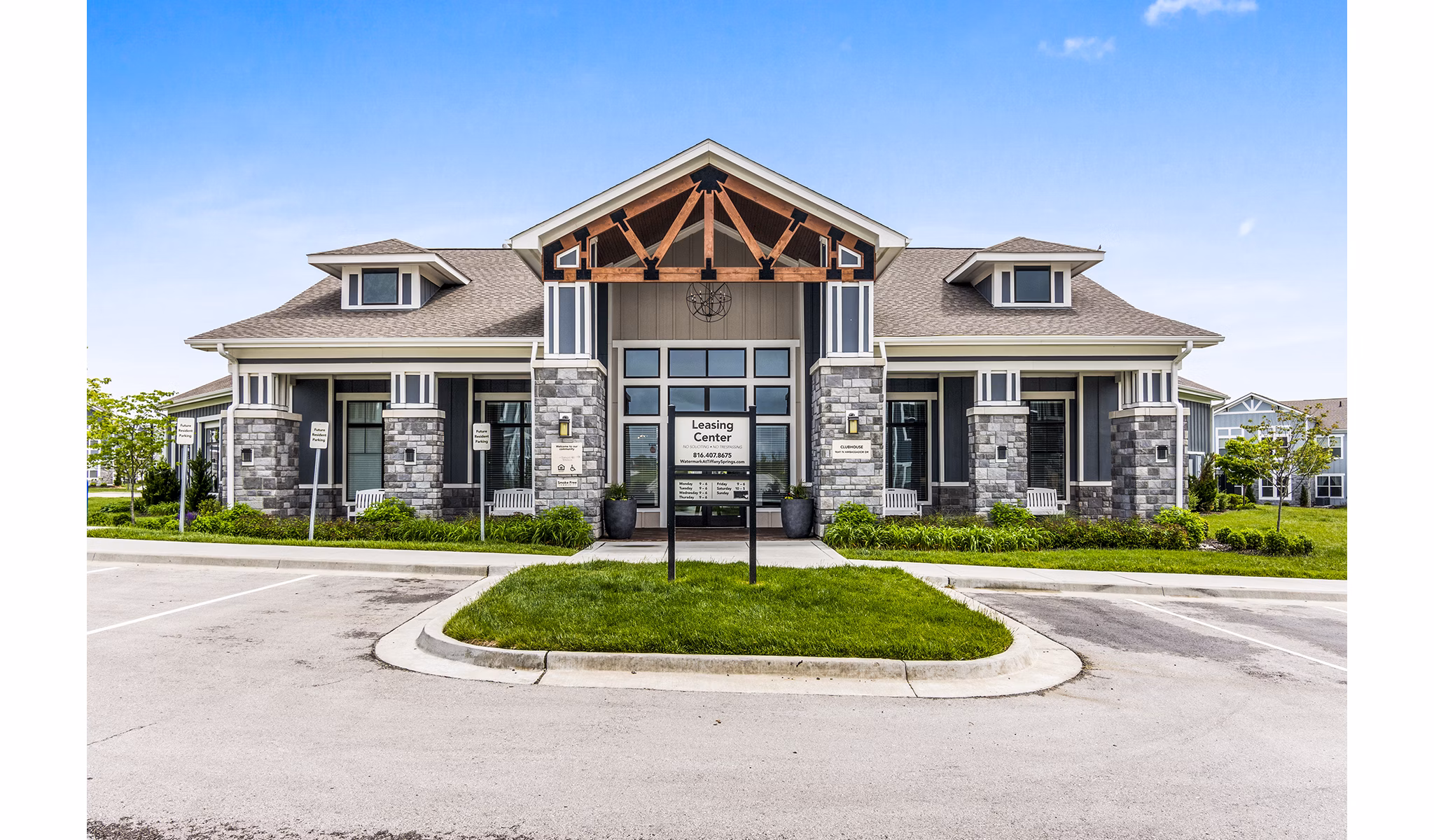 Clubhouse lobby with modern dÃ©cor and cozy seating at The Landing at Tiffany Springs Apartments