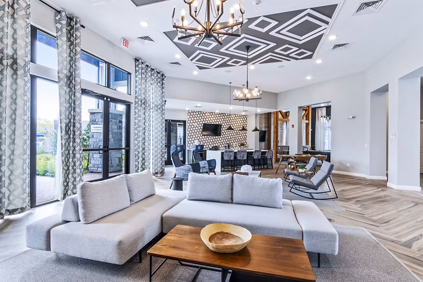 Clubhouse lobby with modern seating and decor at The Landing at Tiffany Springs Apartments, offering luxury living spaces